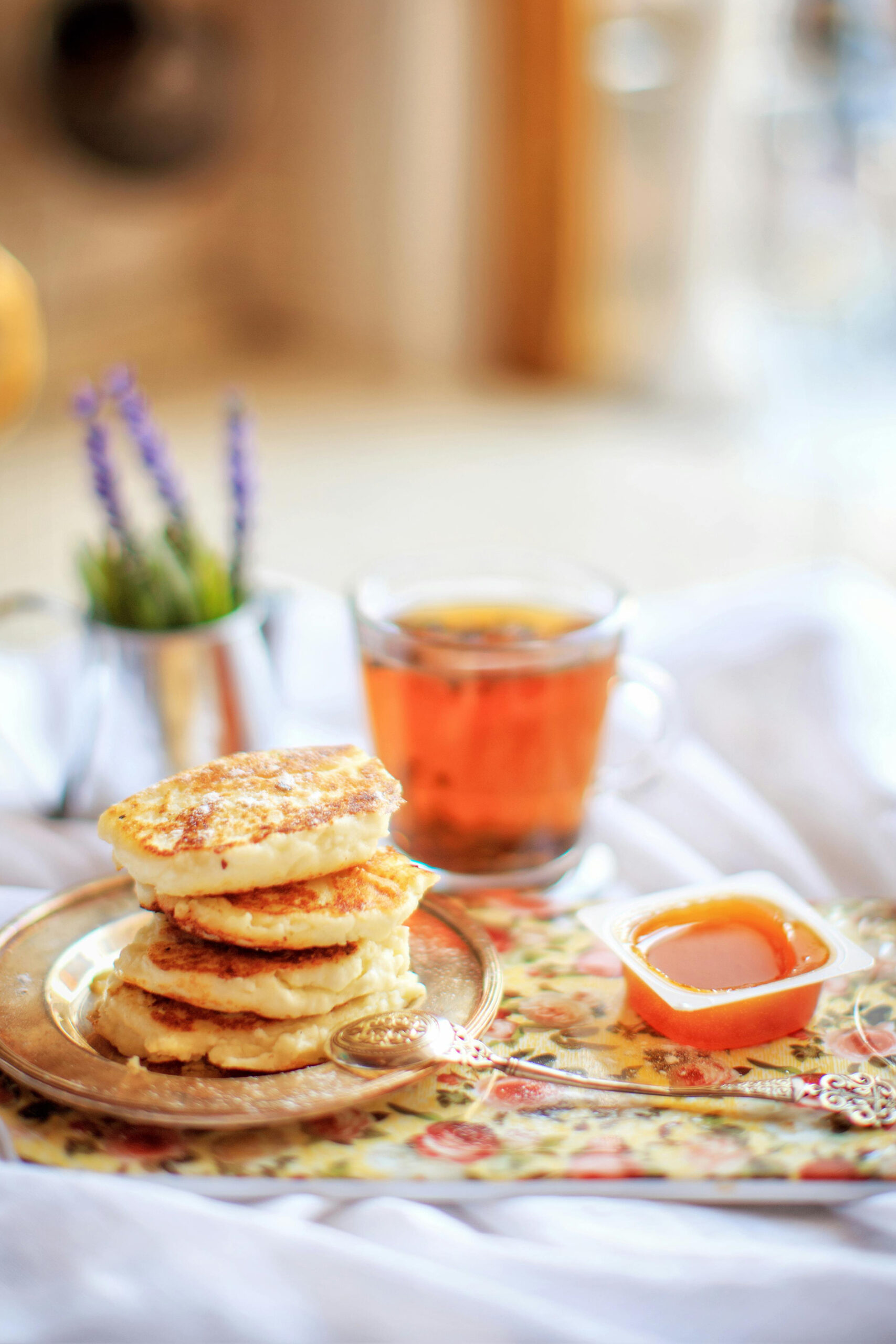 Cozy Morning Pancakes with Honey and a Cup of Tea